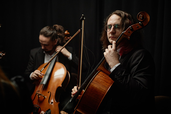 Two cellists in an orchestra